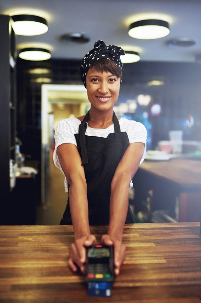 Young business owner waiting for payment